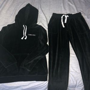 Calvin Klein sweat suits in S/P, black.